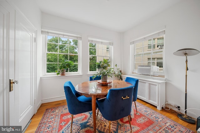 2737 Devonshire Pl NW Unit 321, Washington, DC 20008 - dining area with radiator and light wood-style flooring