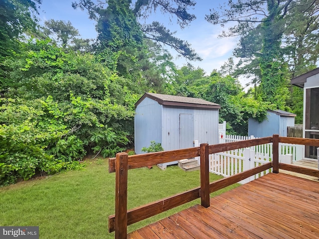 4421 Eastwinds, Chincoteague Island, VA 23336 - wooden deck with a storage unit and a lawn