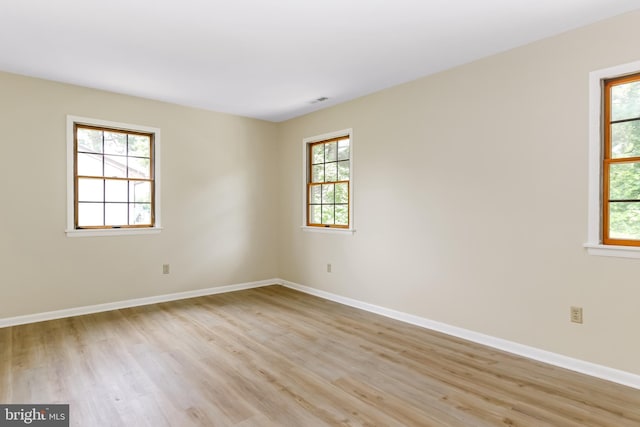 4421 Eastwinds, Chincoteague Island, VA 23336 - empty room featuring plenty of natural light and light wood finished floors