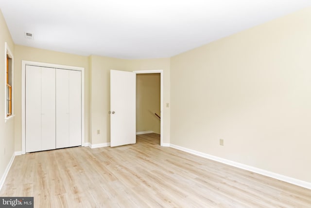 4421 Eastwinds, Chincoteague Island, VA 23336 - unfurnished bedroom with light wood-type flooring and a closet