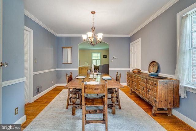 2413 Taylor Ave, Alexandria, VA 22302 - dining area with wood finished floors, crown molding, and a chandelier