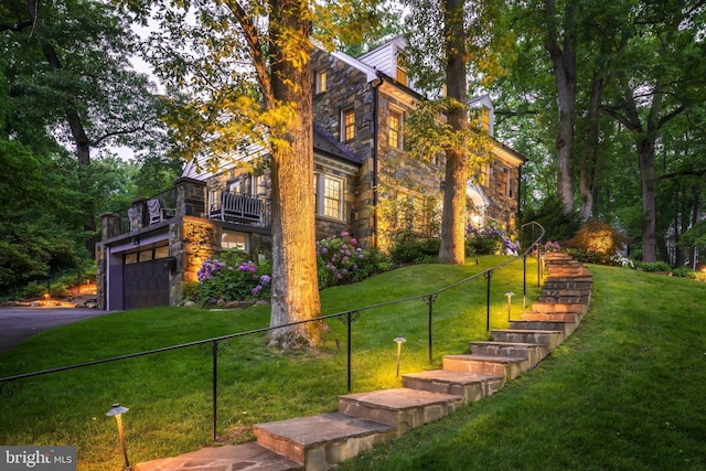 3666 Military Rd, Arlington, VA 22207 - view of front facade with stone siding, a garage, a balcony, and asphalt driveway