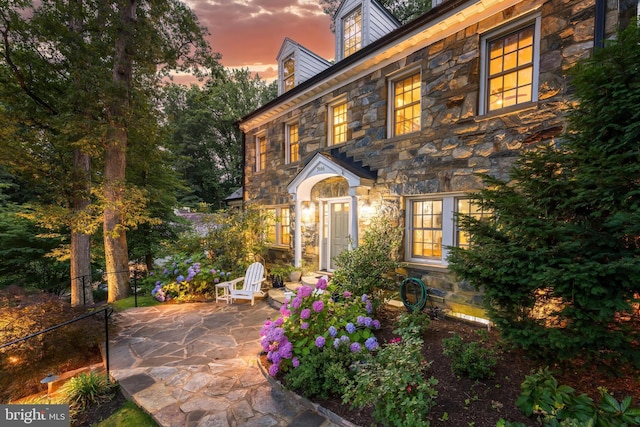 3666 Military Rd, Arlington, VA 22207 - view of front facade featuring stone siding and a patio area