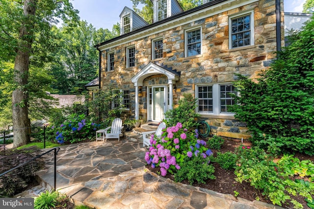3666 Military Rd, Arlington, VA 22207 - colonial inspired home with stone siding and a patio