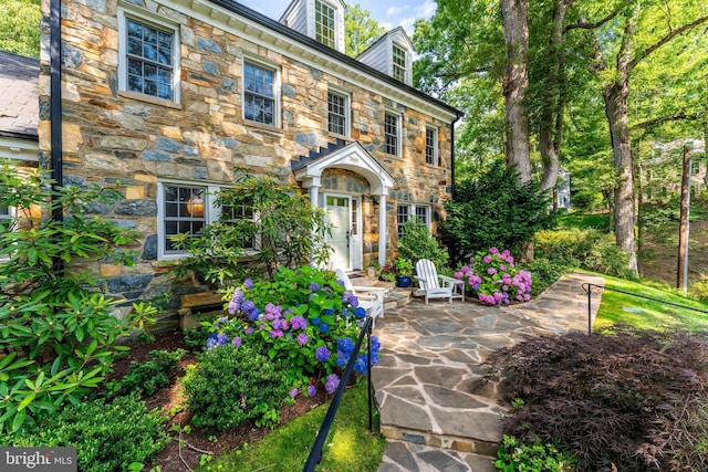 3666 Military Rd, Arlington, VA 22207 - view of front of house with stone siding and a patio area