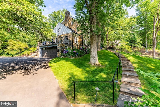 3666 Military Rd, Arlington, VA 22207 - view of front of home with stone siding, stairway, a garage, and a front yard