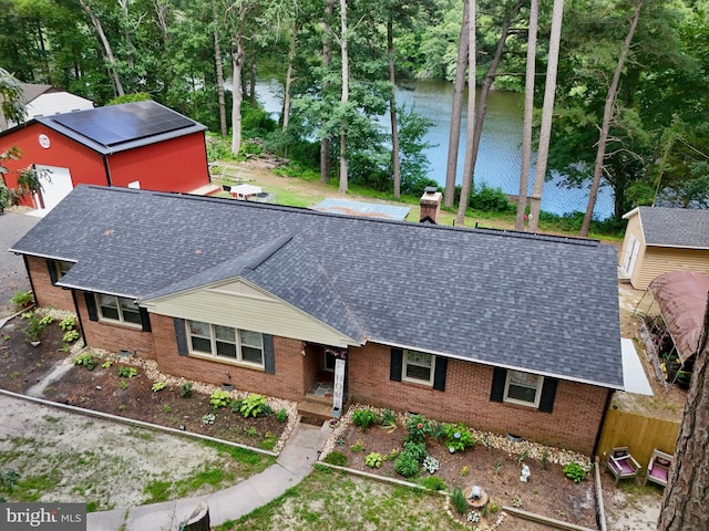 8535 E Marlboro Dr, Delmar, MD 21875 - single story home featuring a shingled roof, brick siding, a water view, and an outbuilding