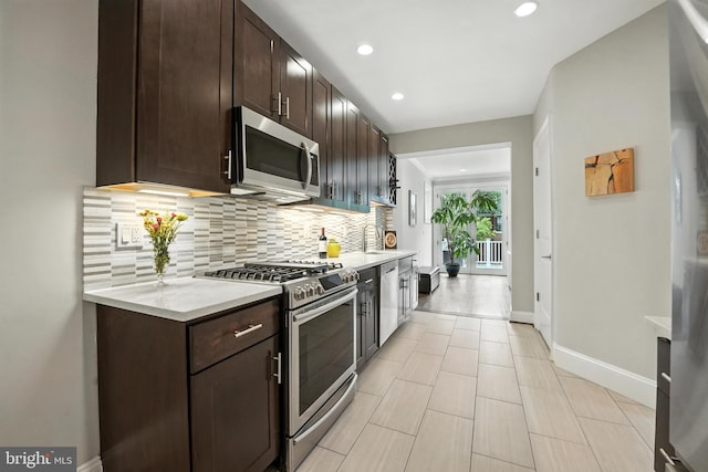 3831 Fulton St NW, Washington, DC 20007 - kitchen with appliances with stainless steel finishes, tasteful backsplash, dark brown cabinetry, light countertops, and recessed lighting