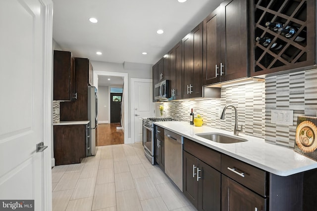 3831 Fulton St NW, Washington, DC 20007 - kitchen featuring stainless steel appliances, dark brown cabinetry, backsplash, and recessed lighting