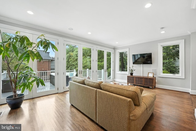 3831 Fulton St NW, Washington, DC 20007 - living room with french doors, crown molding, wood finished floors, and recessed lighting