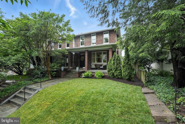 3831 Fulton St NW, Washington, DC 20007 - view of front of property with a porch, brick siding, and a front yard