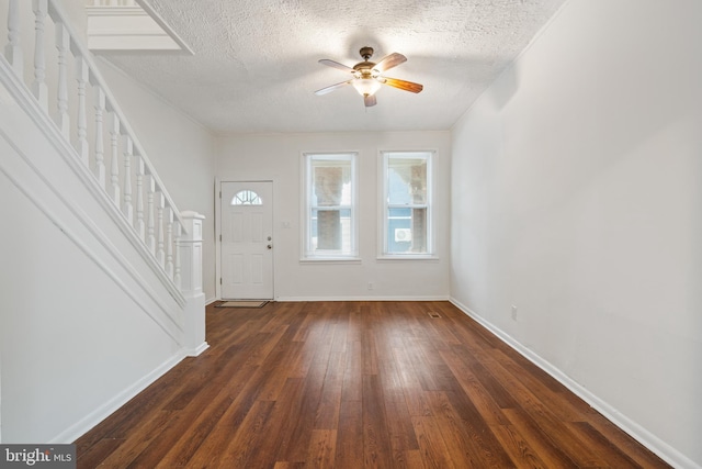 6539 Berdan St, Philadelphia, PA 19119 - entrance foyer featuring stairway, dark wood finished floors, a ceiling fan, and a textured ceiling