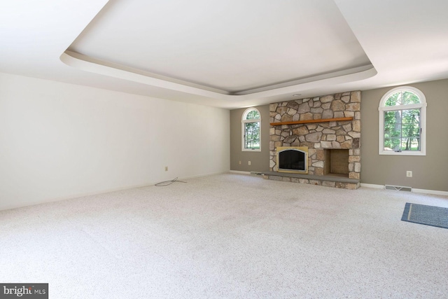 2381 Greensward S, Warrington, PA 18976 - unfurnished living room with a raised ceiling, carpet, and a fireplace