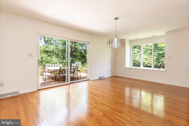 2381 Greensward S, Warrington, PA 18976 - empty room featuring a chandelier and light wood-style floors