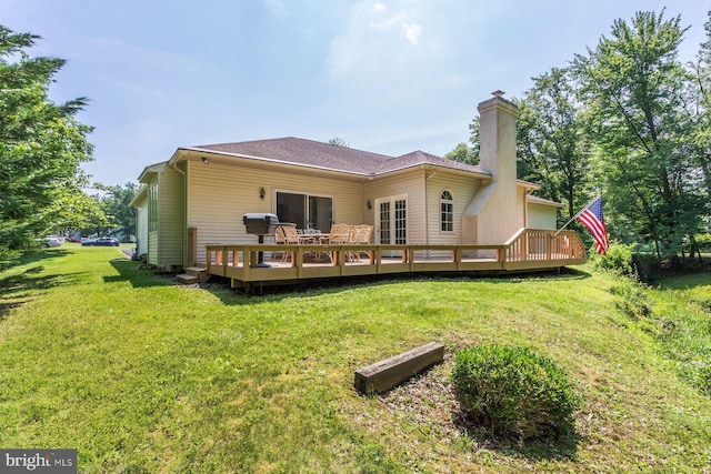 2381 Greensward S, Warrington, PA 18976 - back of house featuring a chimney, a deck, and a yard