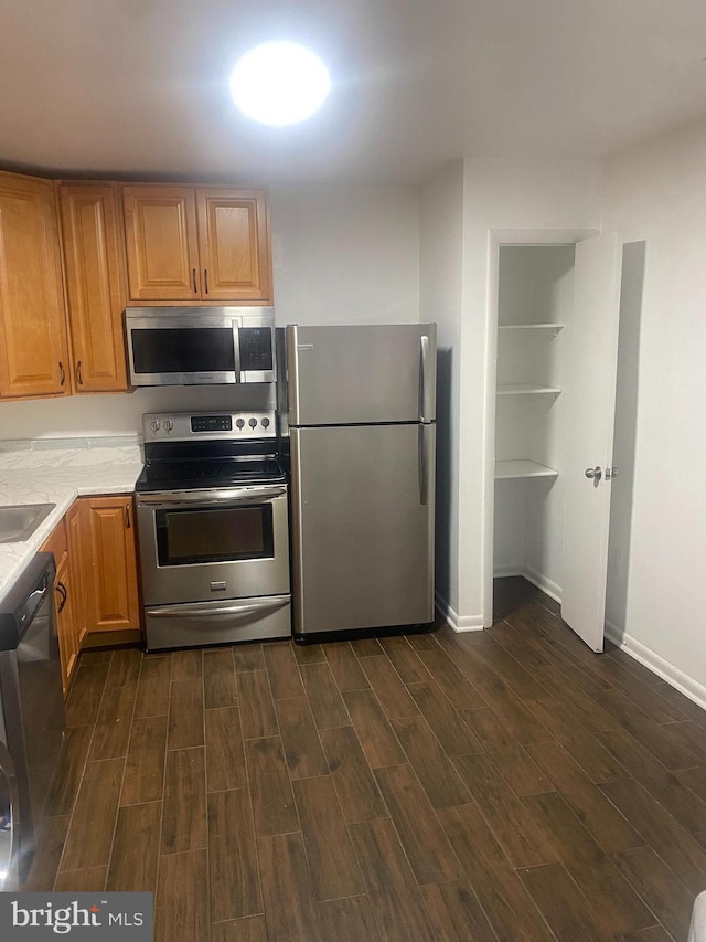 11393 Laurelwalk Dr Unit B-141, Laurel, MD 20708 - kitchen with appliances with stainless steel finishes, dark wood finished floors, and light countertops