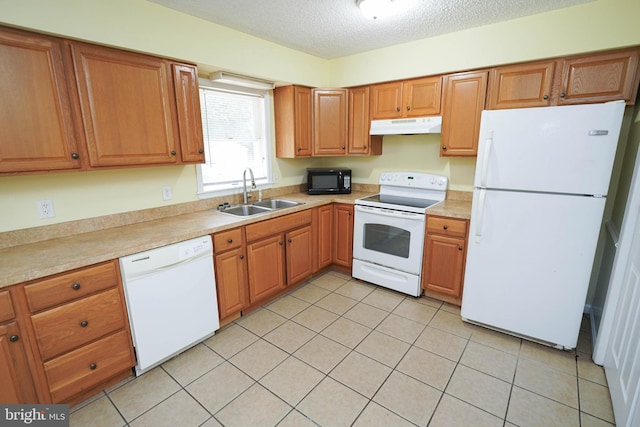 120 Ridgefield Ln, Fruitland, MD 21826 - kitchen featuring white appliances, under cabinet range hood, light countertops, a textured ceiling, and light tile patterned floors