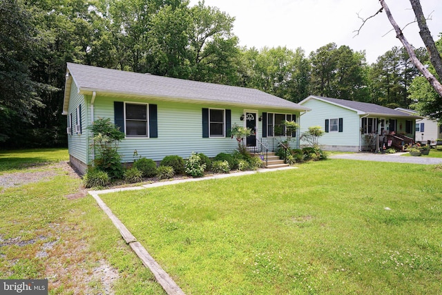 120 Ridgefield Ln, Fruitland, MD 21826 - view of front facade featuring a front yard, view of wooded area, and roof with shingles