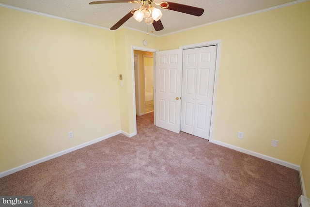 120 Ridgefield Ln, Fruitland, MD 21826 - unfurnished bedroom featuring carpet flooring, a textured ceiling, crown molding, a closet, and ceiling fan