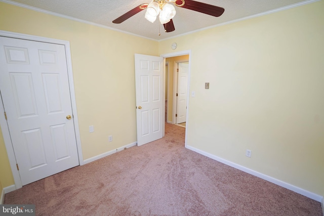 120 Ridgefield Ln, Fruitland, MD 21826 - unfurnished bedroom with carpet, crown molding, a ceiling fan, and a textured ceiling