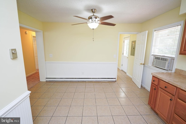 120 Ridgefield Ln, Fruitland, MD 21826 - unfurnished dining area with cooling unit, a baseboard heating unit, ceiling fan, electric panel, and a textured ceiling