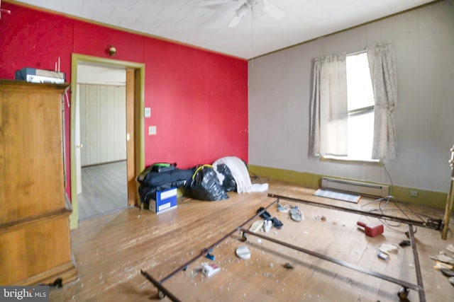319 1st St, Slatington, PA 18080 - empty room with ceiling fan, a baseboard heating unit, and wood finished floors