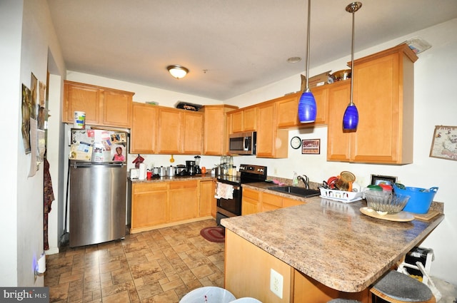 65 Emily Ct, Reading, PA 19606 - kitchen featuring appliances with stainless steel finishes, a peninsula, decorative light fixtures, a breakfast bar, and stone finish flooring