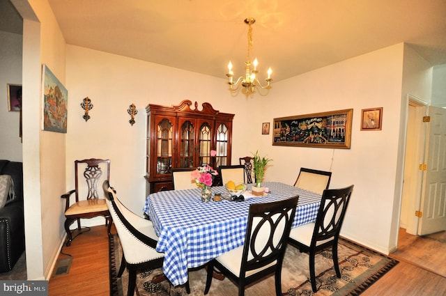 65 Emily Ct, Reading, PA 19606 - dining area featuring a chandelier and wood finished floors