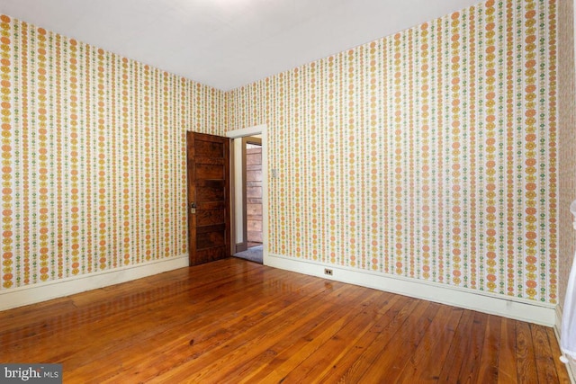 31 4th St, Hanover, PA 17331 - unfurnished room with wallpapered walls and hardwood / wood-style flooring