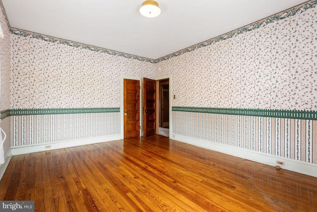 31 4th St, Hanover, PA 17331 - spare room with wallpapered walls and hardwood / wood-style flooring