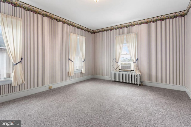 31 4th St, Hanover, PA 17331 - unfurnished room featuring radiator, carpet flooring, cooling unit, and wallpapered walls