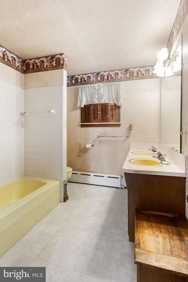 31 4th St, Hanover, PA 17331 - full bath featuring baseboard heating, vanity, and tile patterned floors