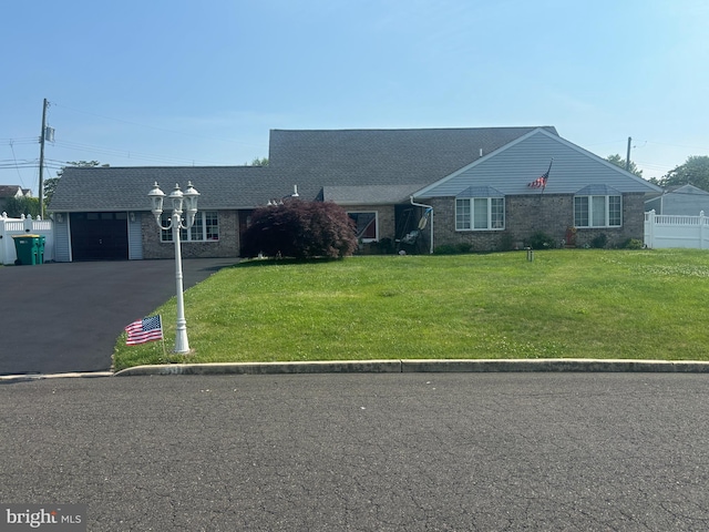 50 Rose Apple Rd, Levittown, PA 19056 - ranch-style home featuring an attached garage, driveway, and brick siding