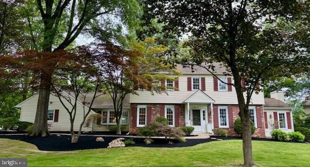 96 Karen Rd, Holland, PA 18966 - colonial house with a front lawn, brick siding, and a chimney