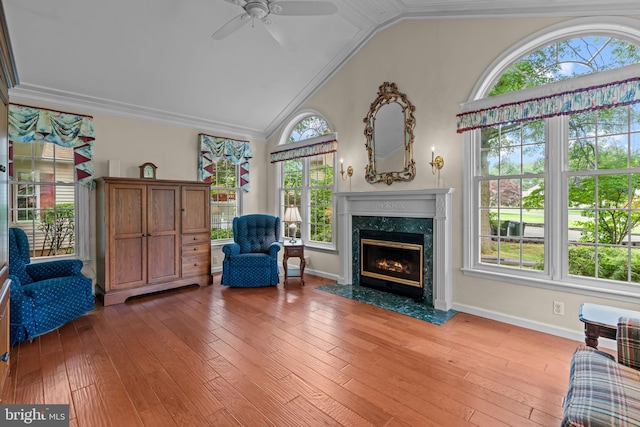 96 Karen Rd, Holland, PA 18966 - living area featuring vaulted ceiling, a ceiling fan, a premium fireplace, wood-type flooring, and crown molding