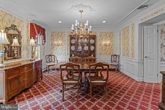 96 Karen Rd, Holland, PA 18966 - dining room with dark colored carpet, a chandelier, wallpapered walls, ornamental molding, and a decorative wall