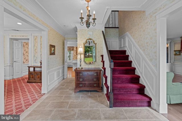96 Karen Rd, Holland, PA 18966 - staircase with wallpapered walls, ornamental molding, a decorative wall, and a chandelier