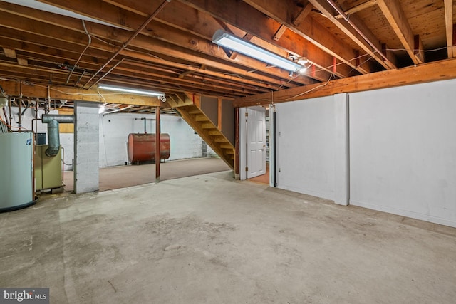 96 Karen Rd, Holland, PA 18966 - unfinished basement featuring oil tank, gas water heater, and stairway