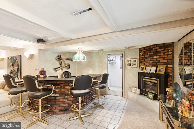 3851 Fawn Ln, White Plains, MD 20695 - indoor dry bar with beam ceiling, tile patterned flooring, and a glass covered fireplace