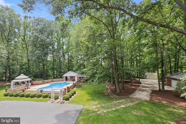 3851 Fawn Ln, White Plains, MD 20695 - view of grassy yard featuring a gazebo, an outdoor structure, an outdoor pool, a storage structure, and a patio area