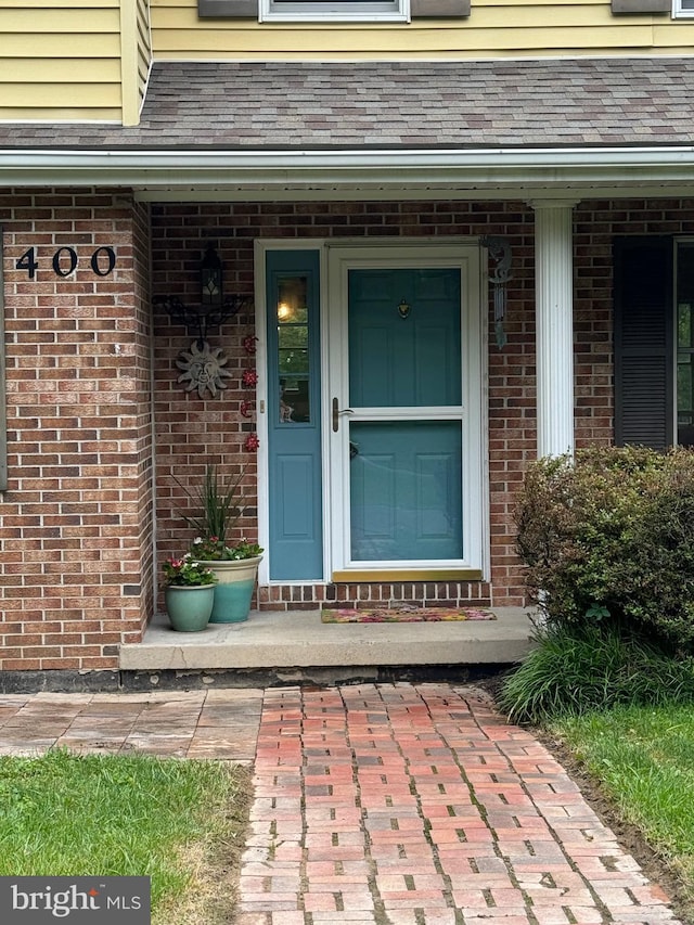400 27th St, Huntingdon, PA 16652 - view of exterior entry with brick siding and a porch