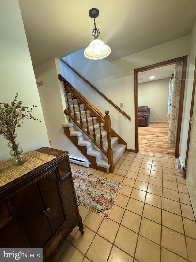 400 27th St, Huntingdon, PA 16652 - stairway featuring tile patterned floors and baseboard heating