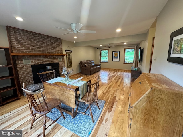 400 27th St, Huntingdon, PA 16652 - dining room featuring wood-type flooring, a ceiling fan, a brick fireplace, and recessed lighting
