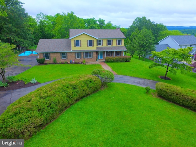 400 27th St, Huntingdon, PA 16652 - view of front of home with a front lawn, brick siding, and driveway