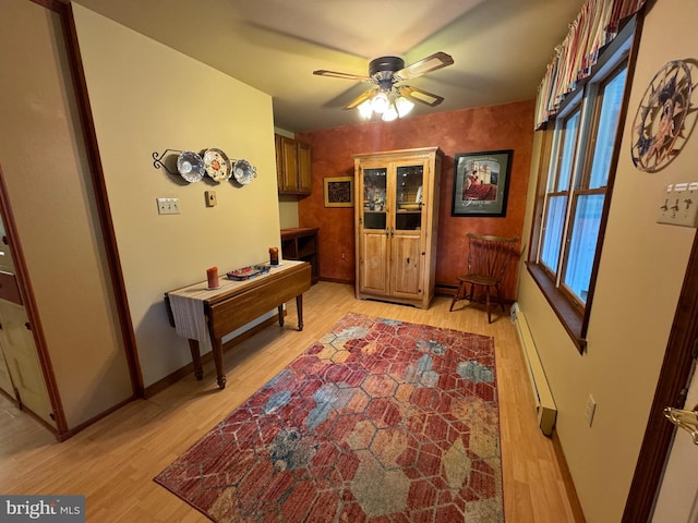 400 27th St, Huntingdon, PA 16652 - office area featuring a baseboard heating unit, light wood-type flooring, and a ceiling fan