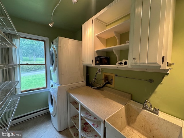 400 27th St, Huntingdon, PA 16652 - washroom with stacked washing machine and dryer, cabinet space, and a baseboard radiator