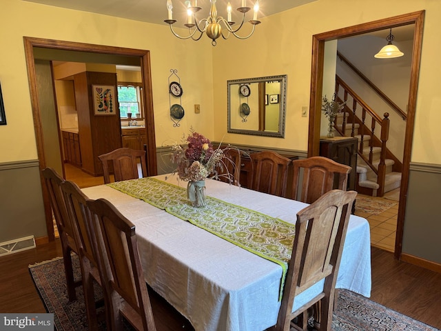 400 27th St, Huntingdon, PA 16652 - dining room featuring a chandelier, wood finished floors, and stairway