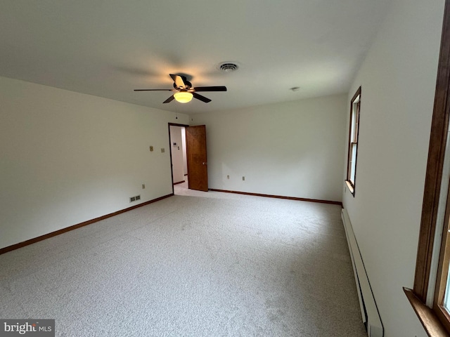400 27th St, Huntingdon, PA 16652 - empty room featuring a baseboard radiator, light colored carpet, and a ceiling fan