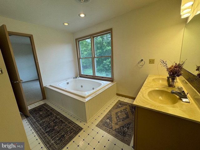 400 27th St, Huntingdon, PA 16652 - bathroom featuring double vanity, a jetted tub, recessed lighting, and tile patterned floors