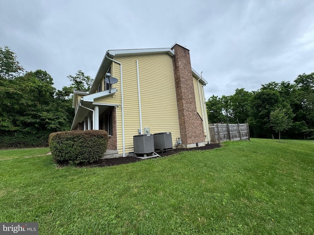400 27th St, Huntingdon, PA 16652 - view of side of home featuring a cooling unit and a chimney